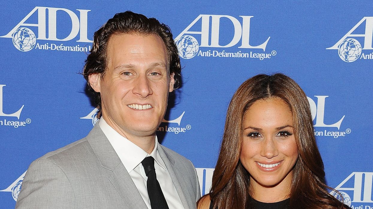 Trevor Engelson and Meghan Markle