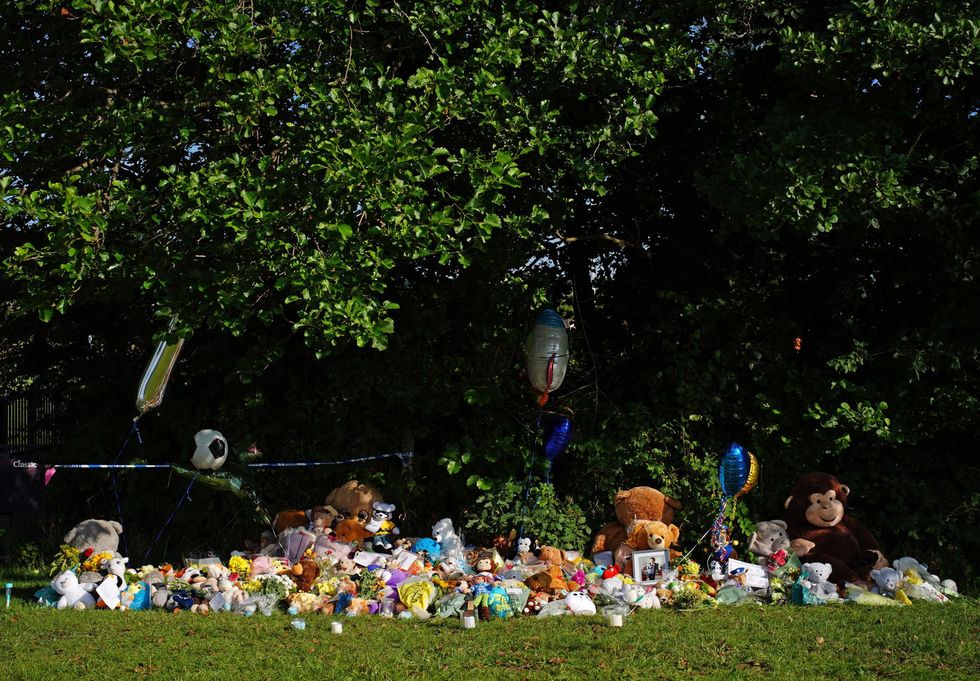 Tributes left at the scene in the Sarn area of Bridgend, south Wales, near to where five-year-old Logan Mwangi was found dead in the Ogmore River on Saturday.