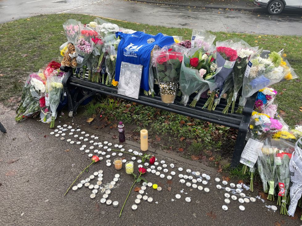 Tributes left on a bench on Broadgate Lane, Horsforth, following the death of 15-year-old boy Alfie Lewis