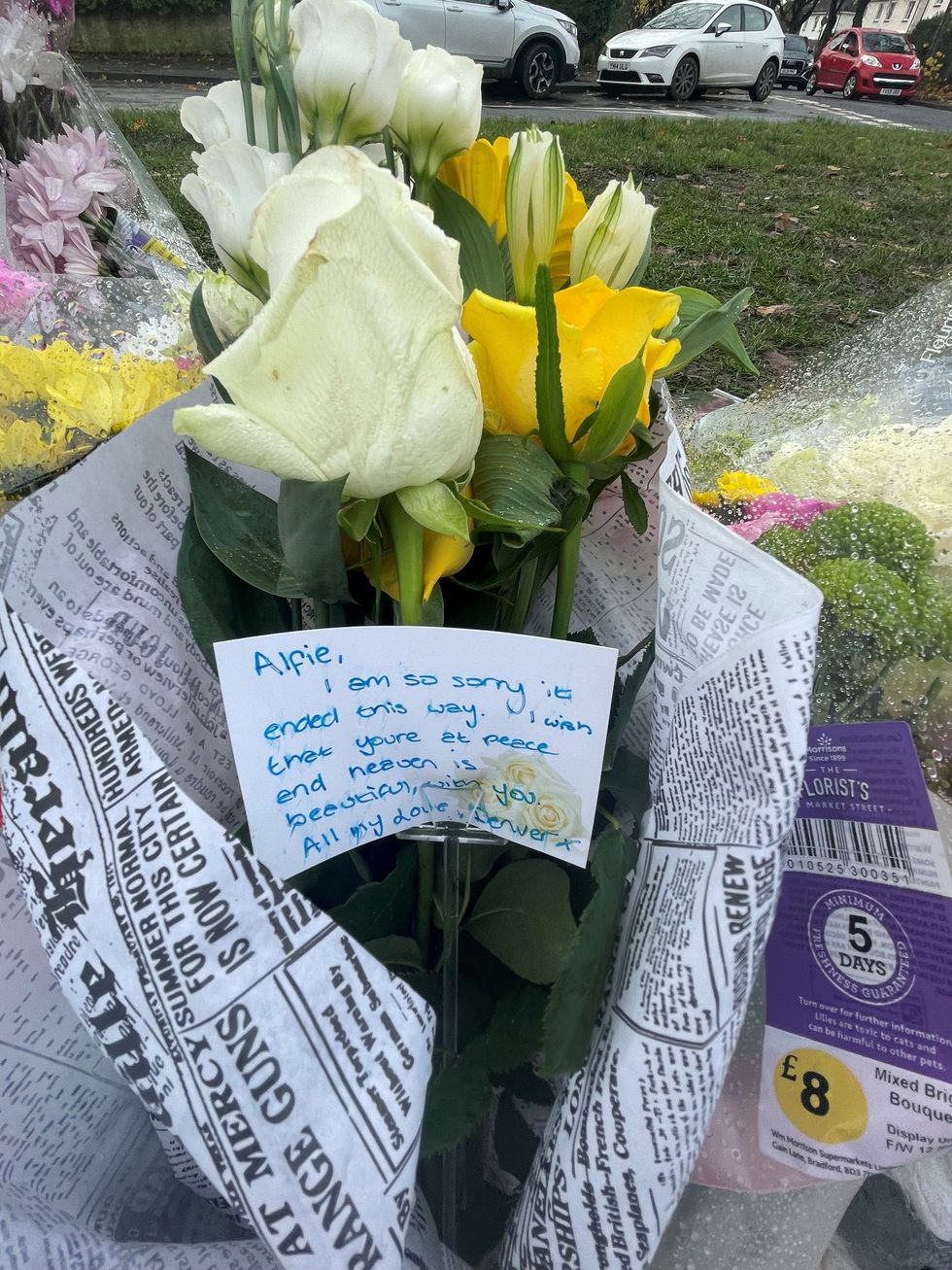 Tributes left on a bench on Broadgate Lane, Horsforth, following the death of Alfie Lewis