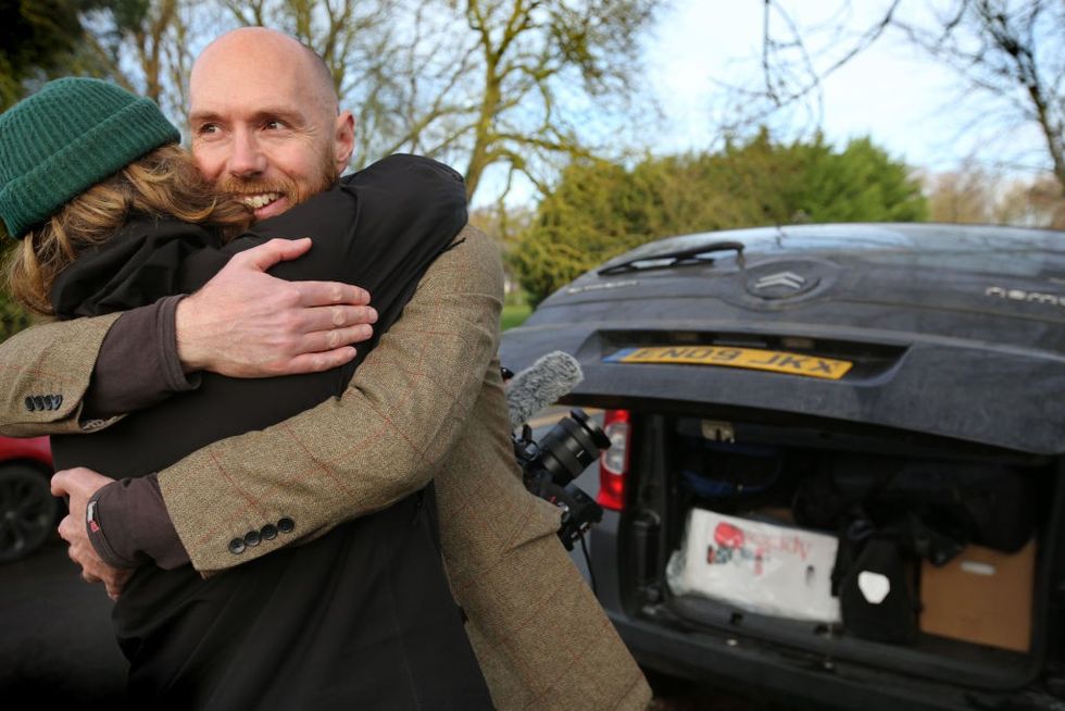 Trowland hugging a relative