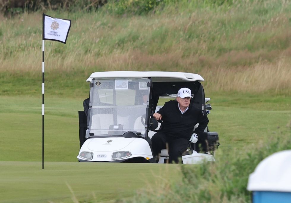 Trump making his way around the course on his buggy