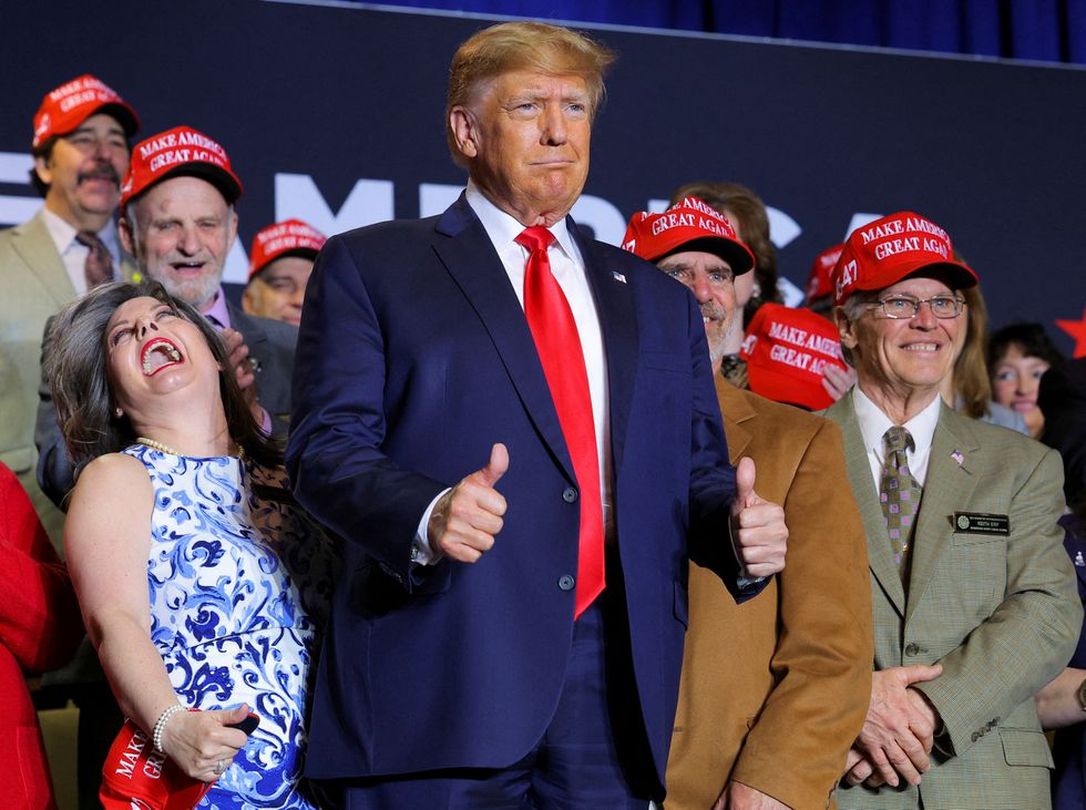 Trump with supporters at a New Hampshire rally