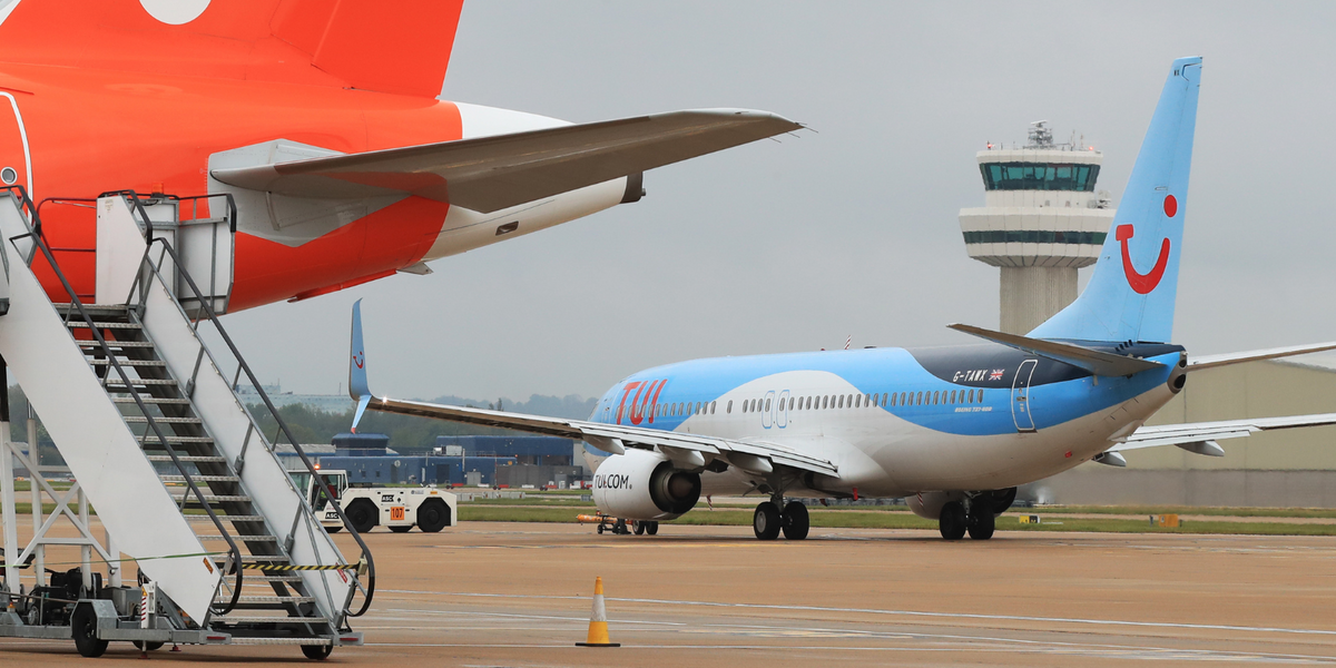 NextImg:Tui passengers forced to exit via emergency slides in Belgium after urgent alarm sparked unexpected landing