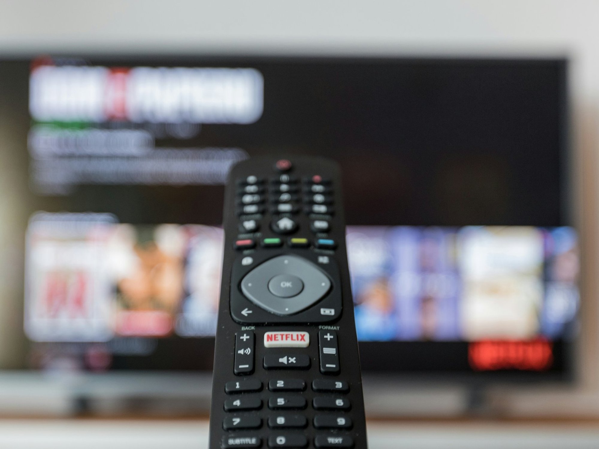 TV remote in front of television