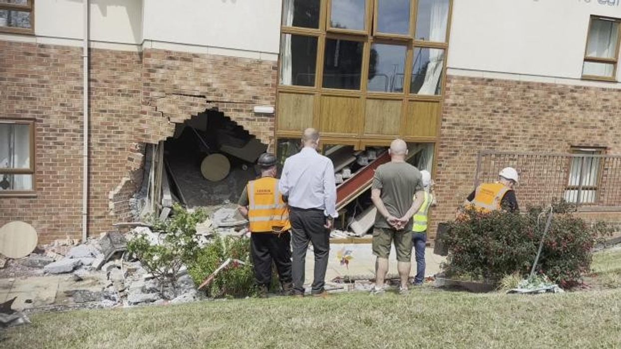 Two pensioners dead after BMW crashes into care home during police chase