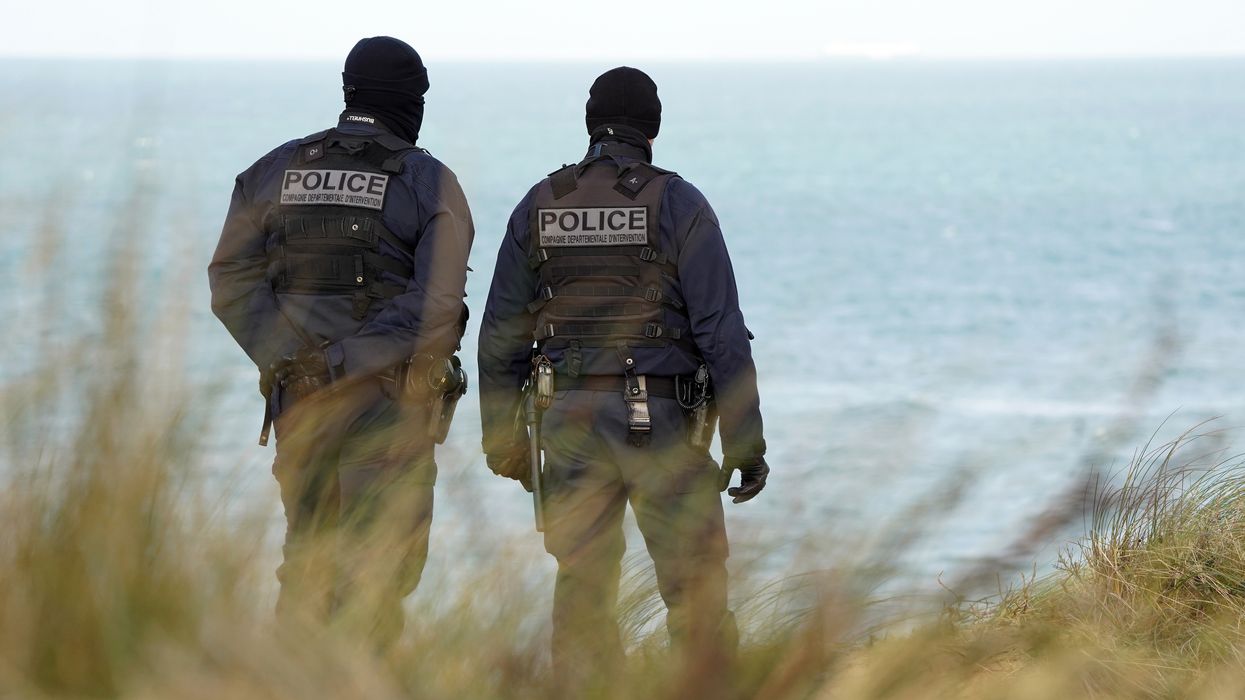 Two French police injured in clashes with migrants as numbers crossing Channel tops 15,000