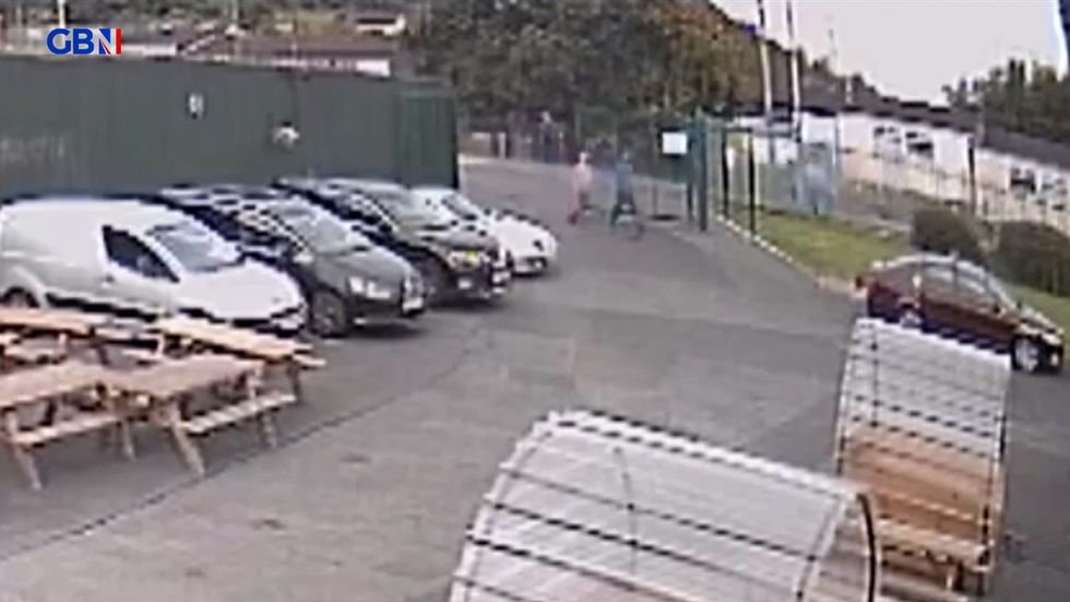 Two men are seen entering the grounds of the Donegal Celtic Sports and Social Club