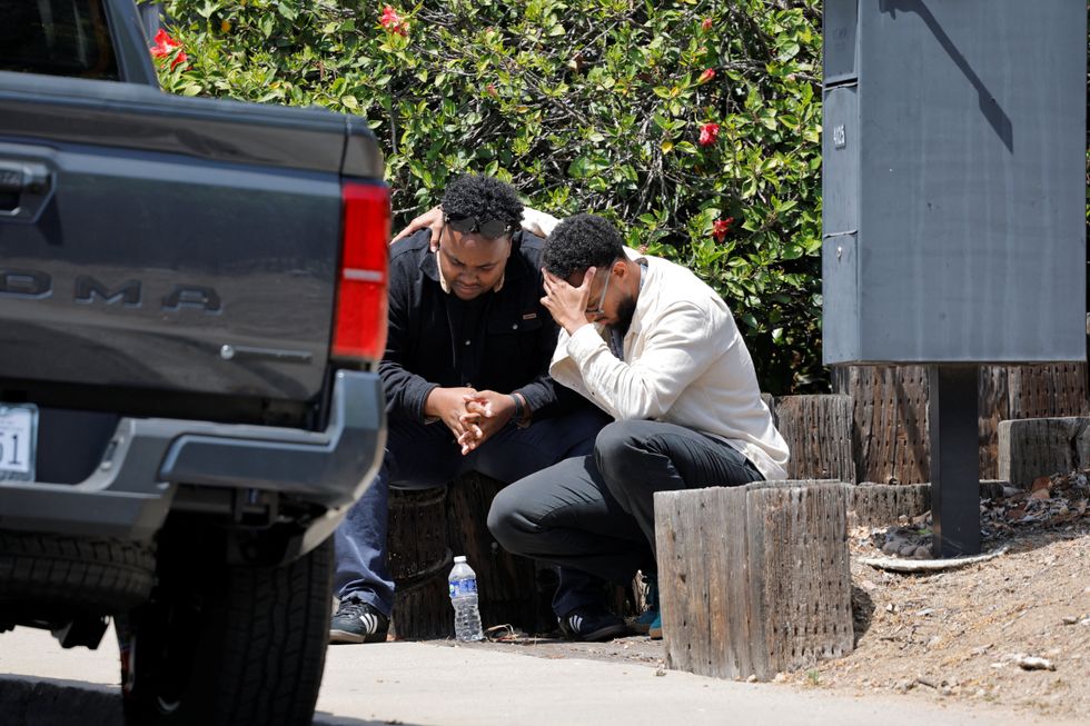 Two men consoling each other after the shooting at the Islamic Centre in San Diego, California\u200b