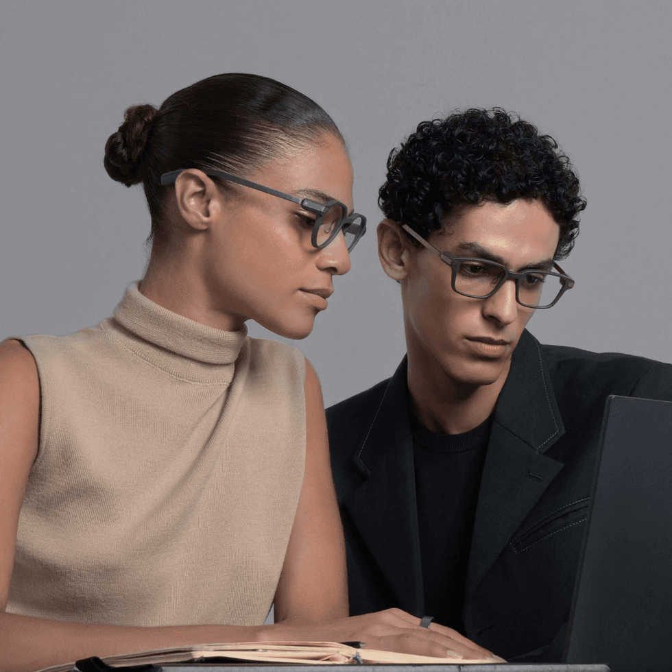 Two models wearing Even G2 smart glasses