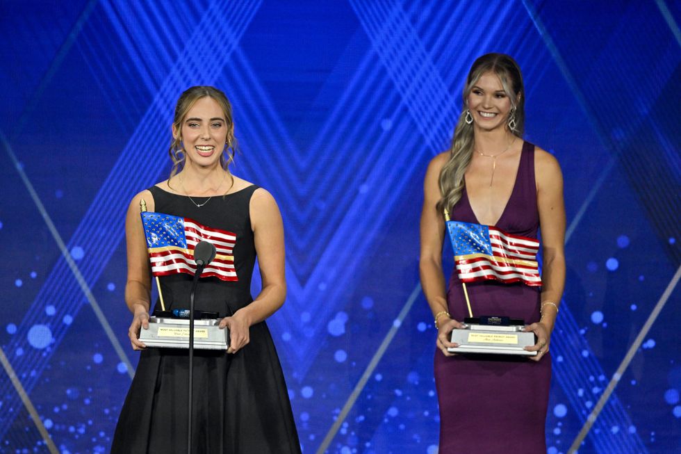 Two Oregon high school athletes who staged a protest at a state championship event earlier this year have been recognised at a national conservative awards ceremony, receiving praise for refusing to share a podium with a transgender competitor