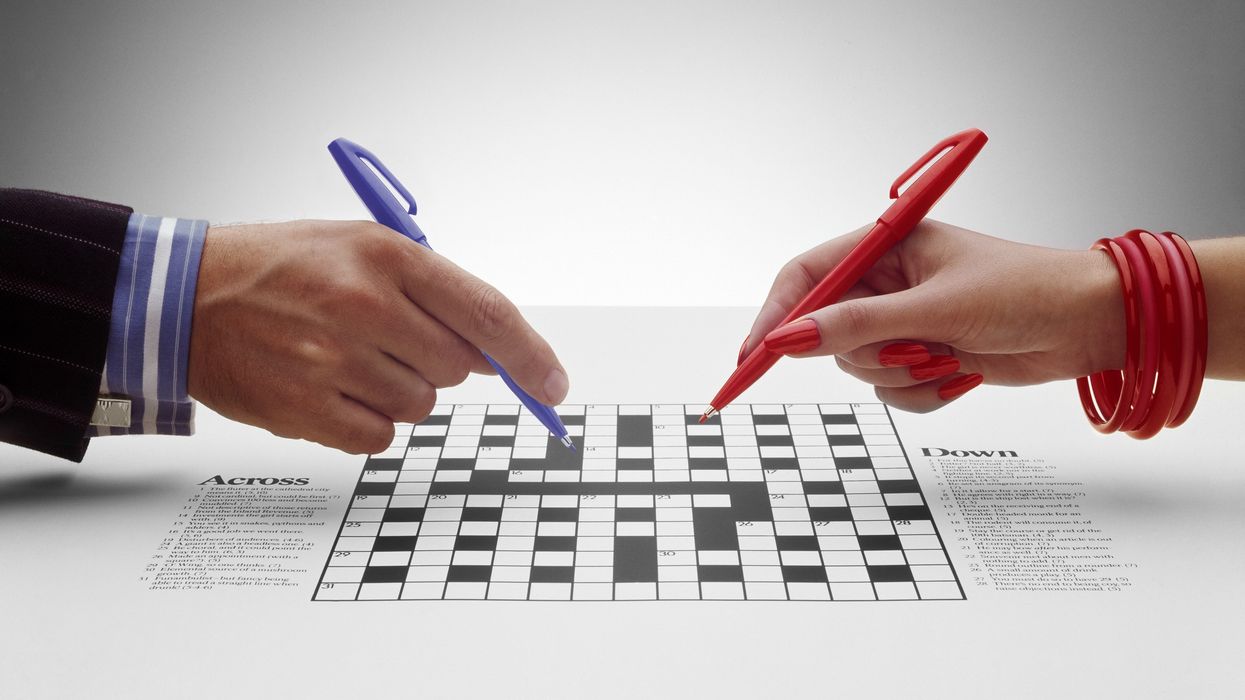 Two people doing a crossword