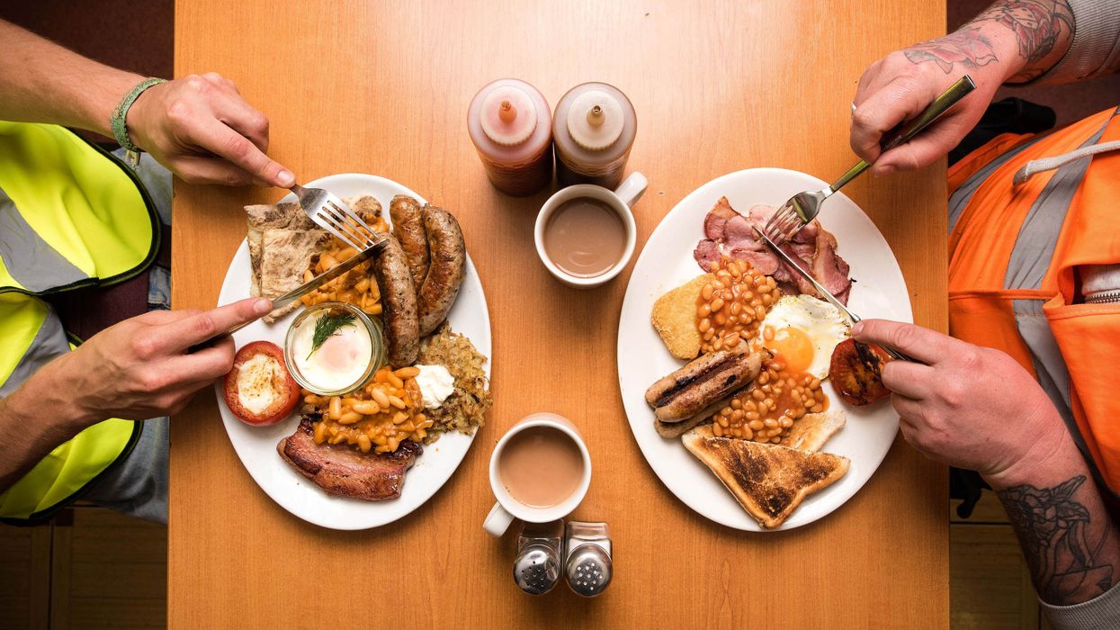 Two people eating an English breakfast