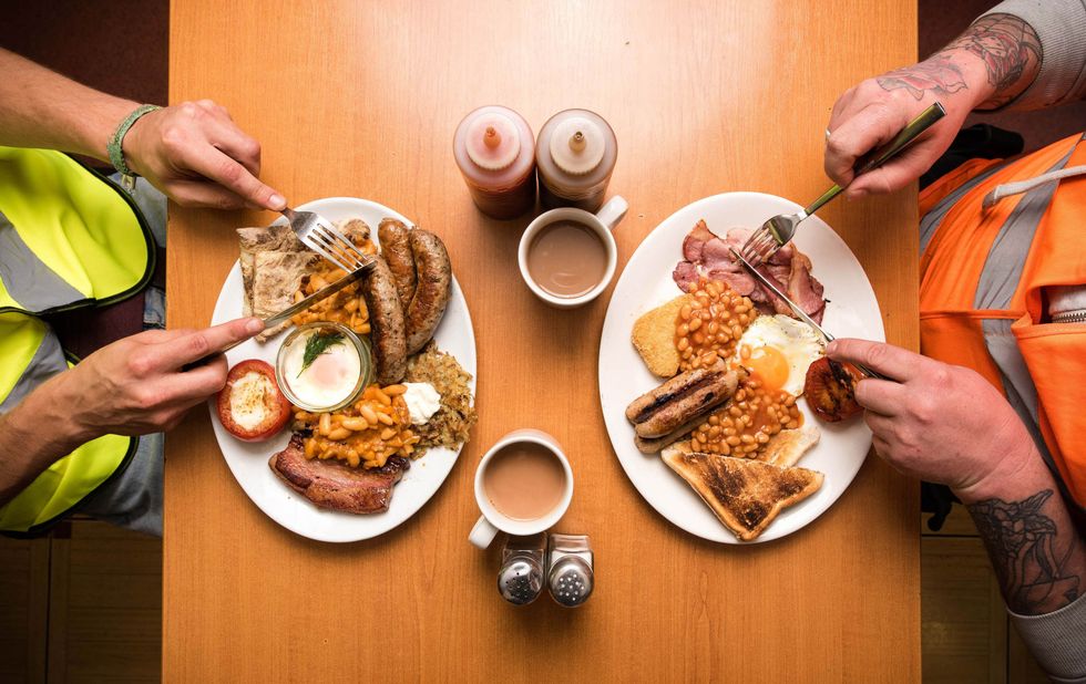 Two people eating an English breakfast