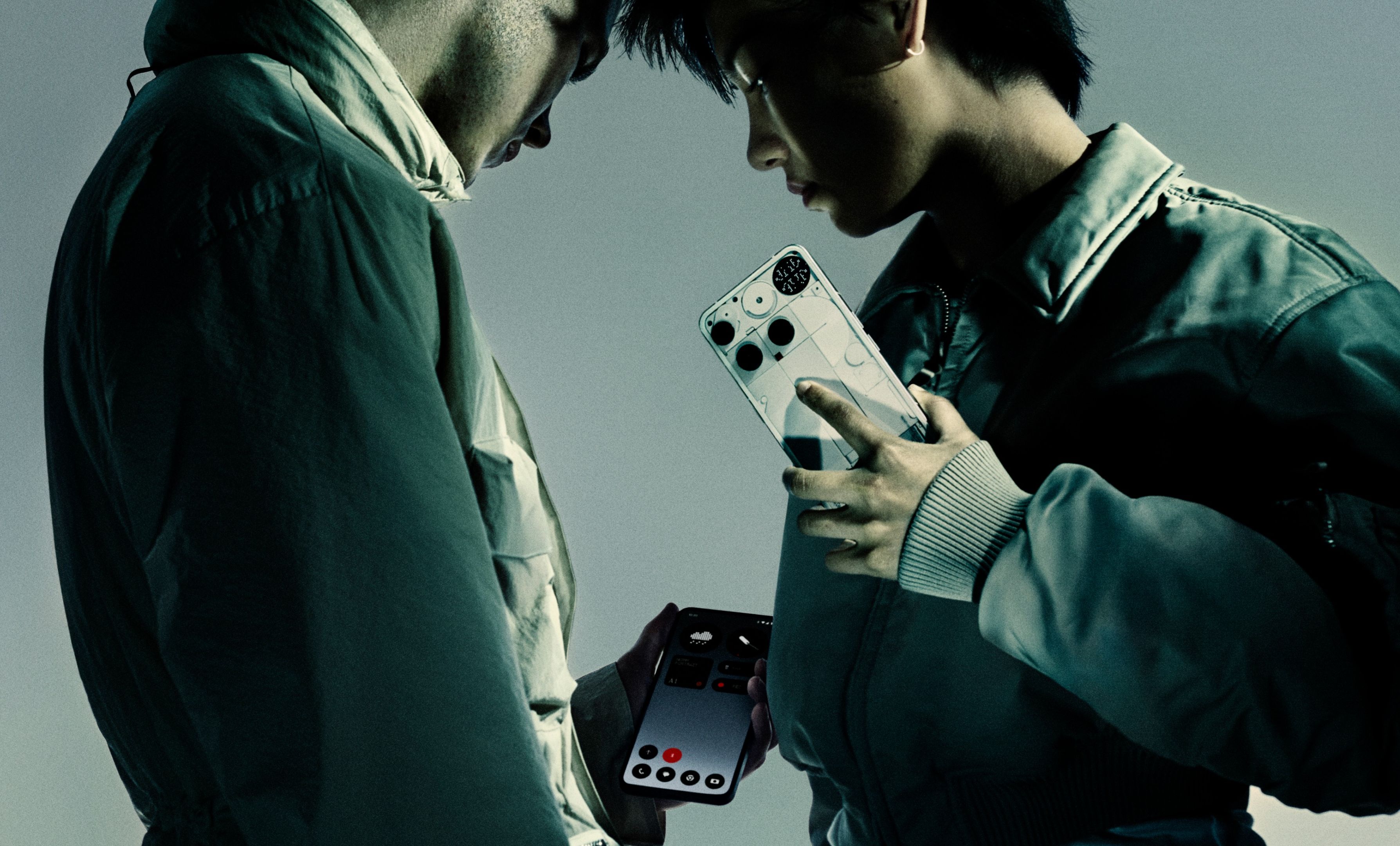 two people holding nothing phone 3