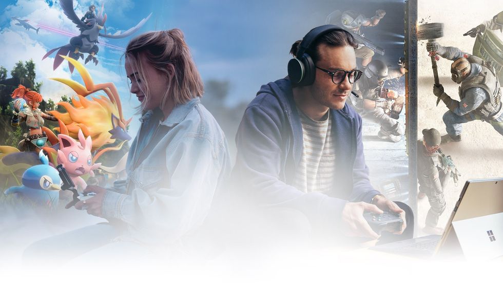 two people sit back to back playing video games on a phone and windows surface device surrounded by characters from the games