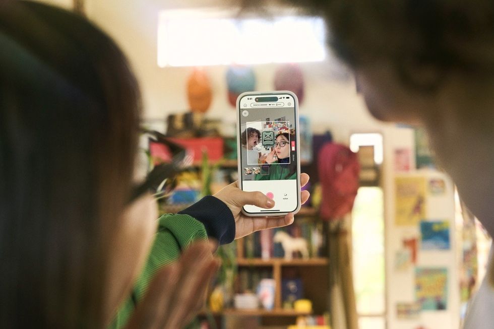 Two people taking a photo using the