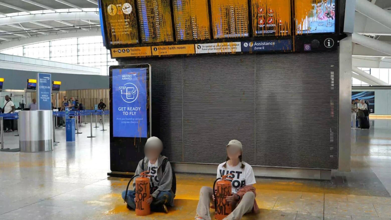 Two protesters sat in the terminal building