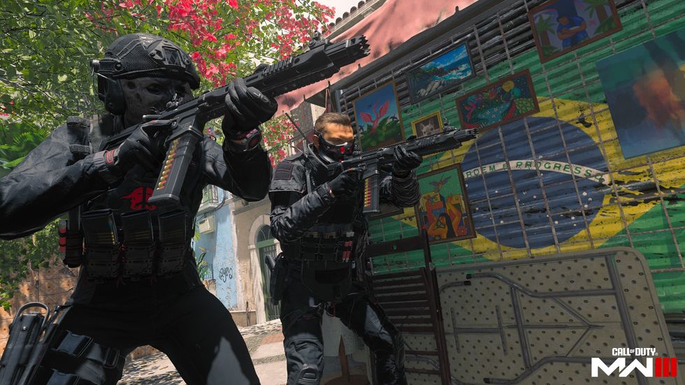 two soldiers dressed in black firing assault weapons in call of duty modern warfare 3