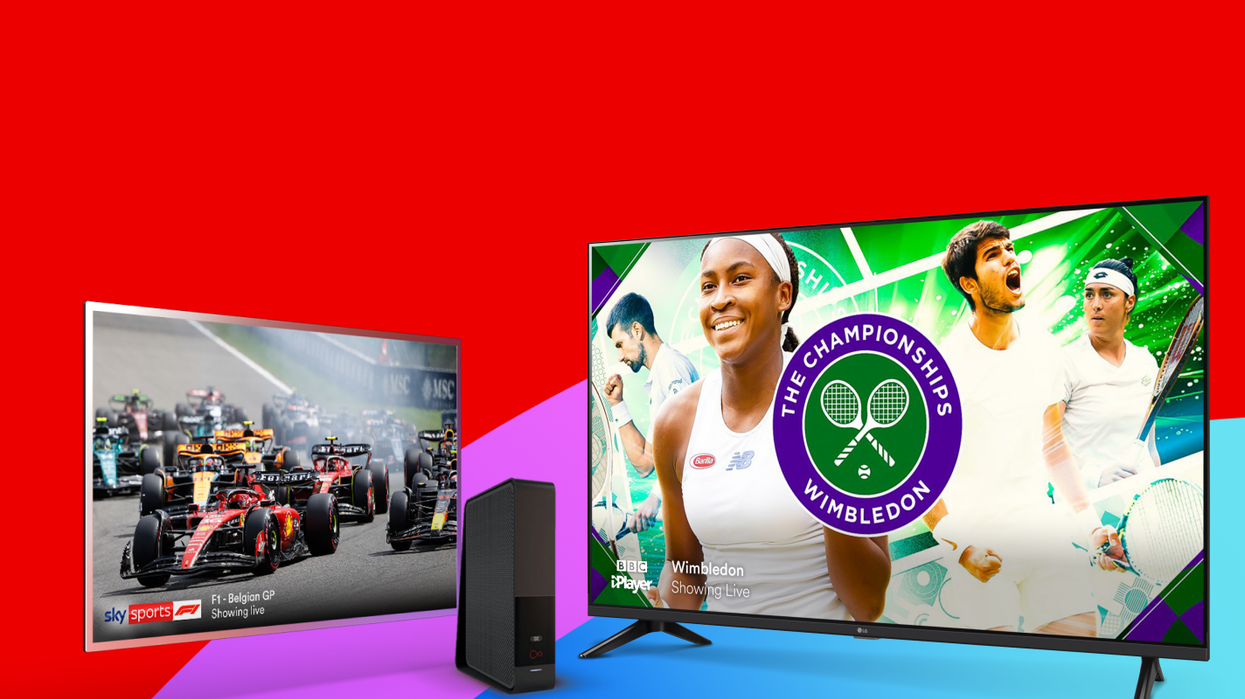 two televisions showing Sky Sports HD with a Virgin Media Wi-Fi router in the centre