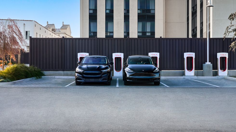 Two Tesla cars at Tesla Supercharger