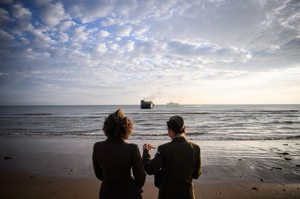 Two women dressed in military attire D-Day commemorations in France