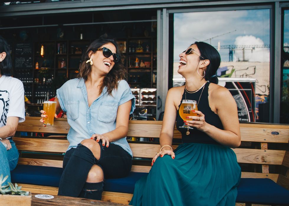 Two women drinking beer