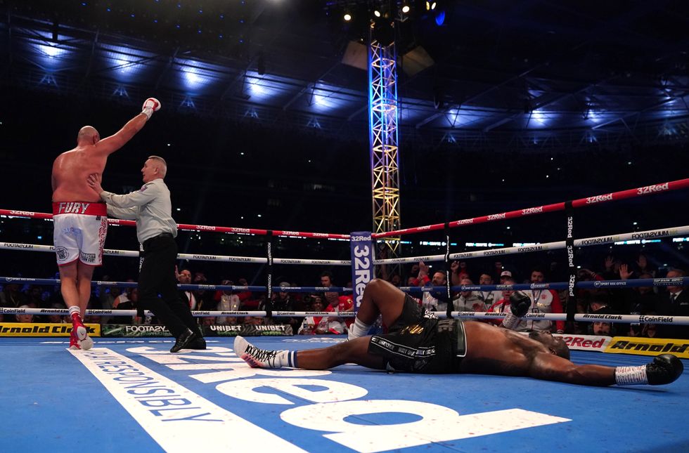 Tyson Fury celebrates after knocking down Dillian Whyte during the WBC heavyweight title fight at Wembley Stadium, London. Picture date: Saturday April 23, 2022.