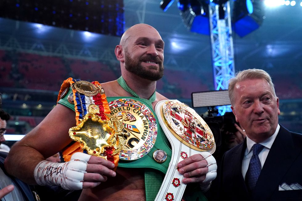 Tyson Fury following victory over Dillian Whyte with Promoter, Frank Warren (right) at Wembley Stadium, London. Picture date: Saturday April 23, 2022.