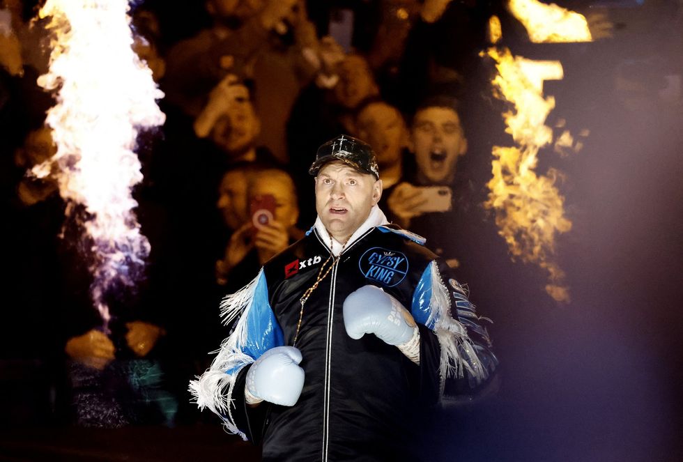 Tyson Fury made his way draped in sky blue, in a mark of respect to Ricky Hatton