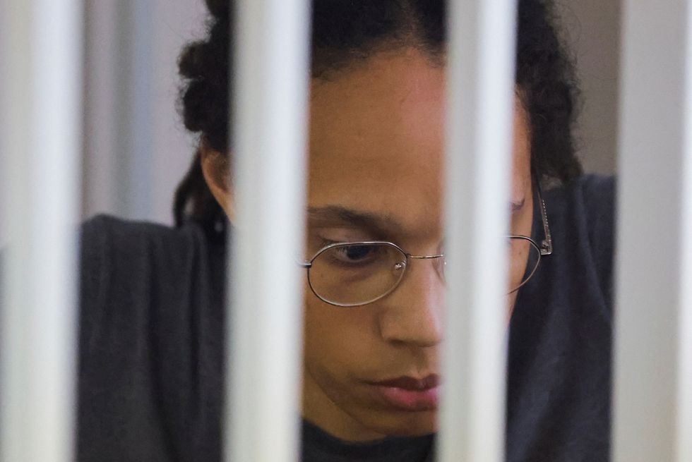 U.S. basketball player Brittney Griner, who was detained at Moscow's Sheremetyevo airport and later charged with illegal possession of cannabis, sits inside a defendants' cage after the court's verdict in Khimki outside Moscow, Russia August 4, 2022. REUTERS/Evgenia Novozhenina/Pool