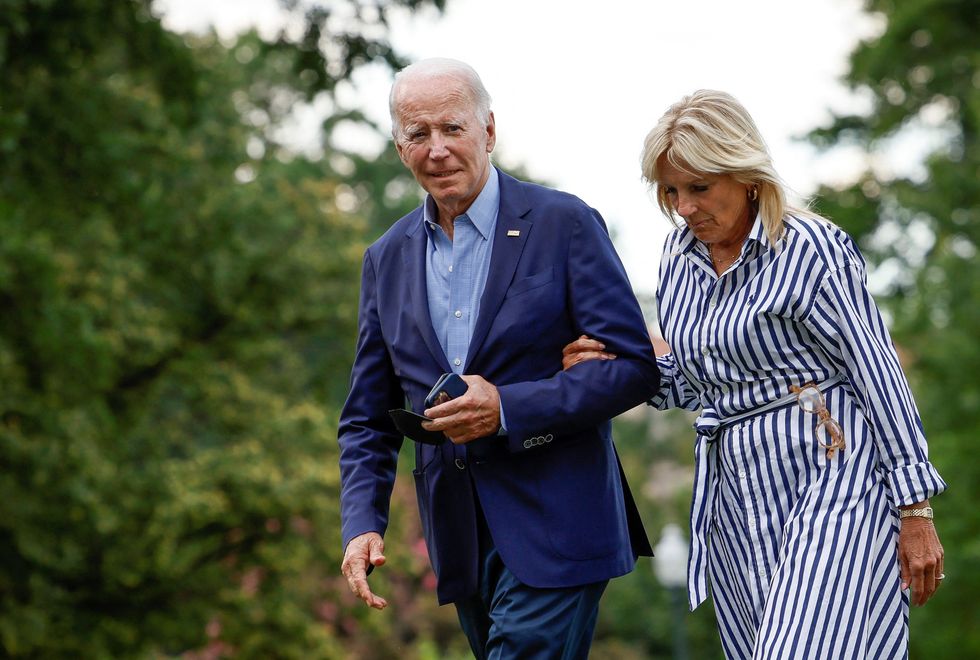 U.S. President Joe Biden and first lady Jill Biden arrive at the White House following a trip to flood ravaged eastern Kentucky, in Washington, U.S., August 8, 2022. REUTERS/Evelyn Hockstein