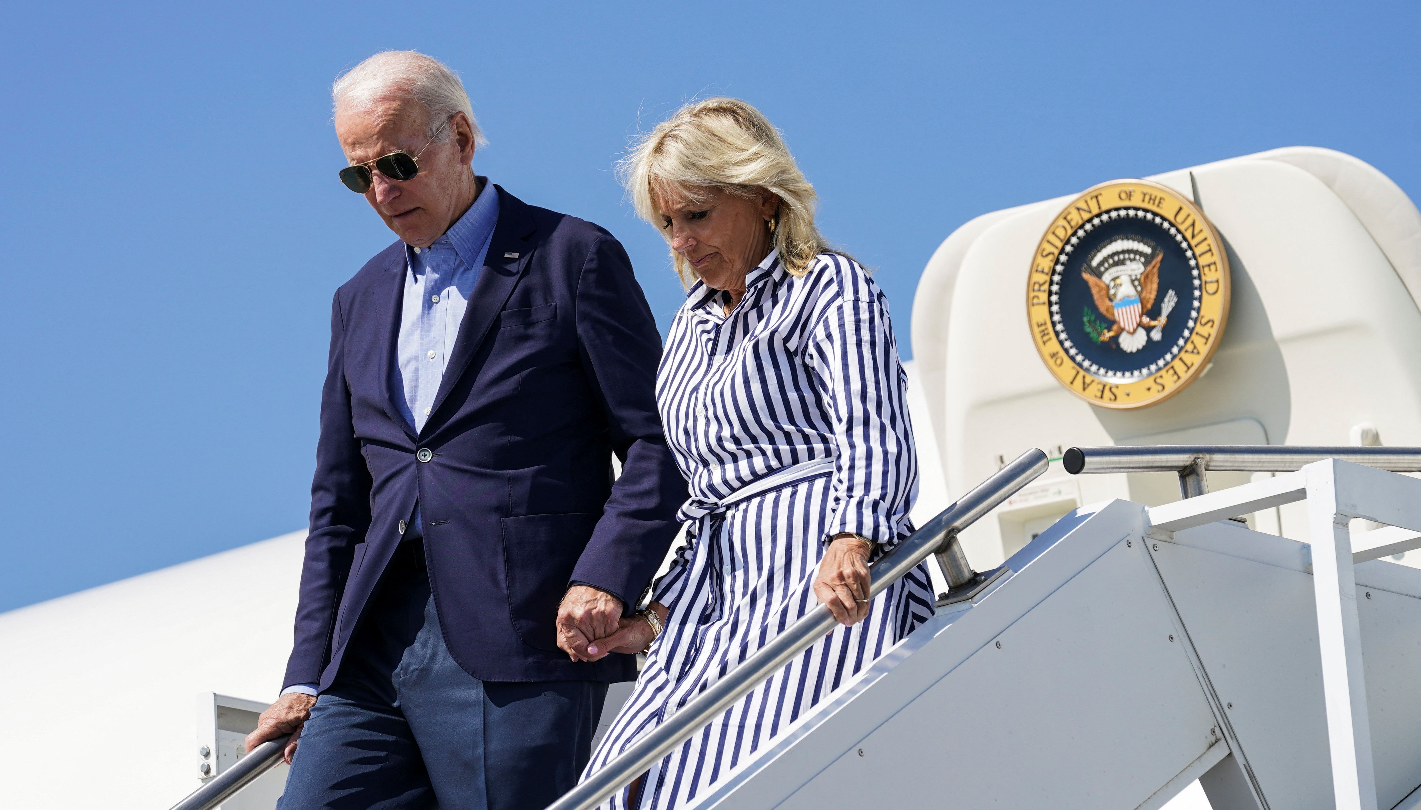 U.S. President Joe Biden and first lady Jill Biden disembark Air Force One while traveling to visit families affected by devastation from recent flooding, as they arrive at Blue Grass Airport in Lexington, Kentucky, U.S.
