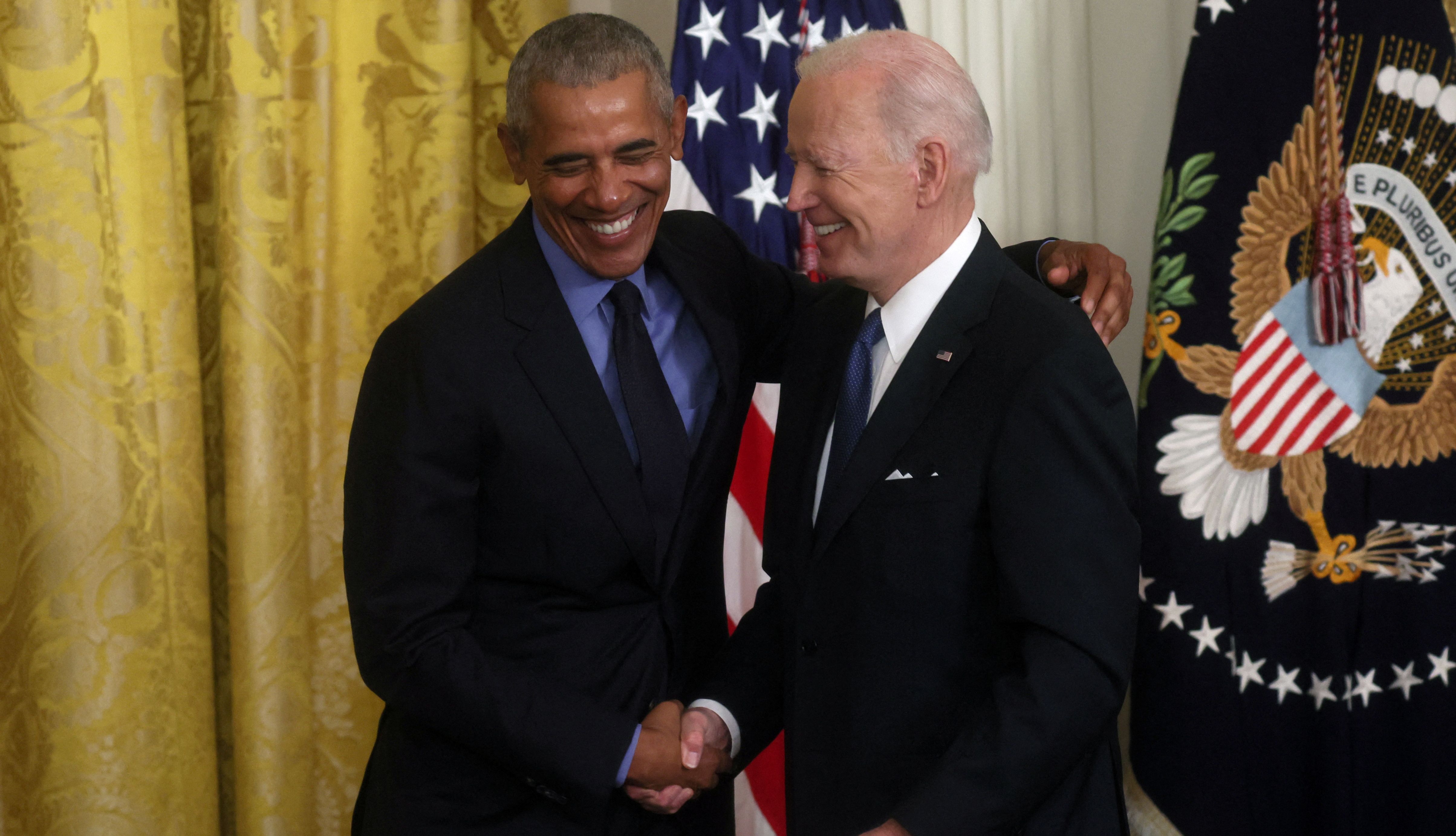 U.S. President Joe Biden and former U.S. President Barack Obama embrace after they spoke about the Affordable Care Act and Medicaid at the White House in Washington, U.S., April 5, 2022. REUTERS/Leah Millis