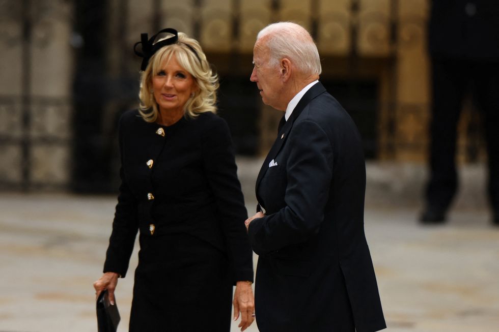 U.S. President Joe Biden and U.S. first lady Jill Biden walk outside Westminster Abbey, on the day of the state funeral and burial of Britain's Queen Elizabeth, in London, Britain, September 19, 2022. REUTERS/Kai Pfaffenbach