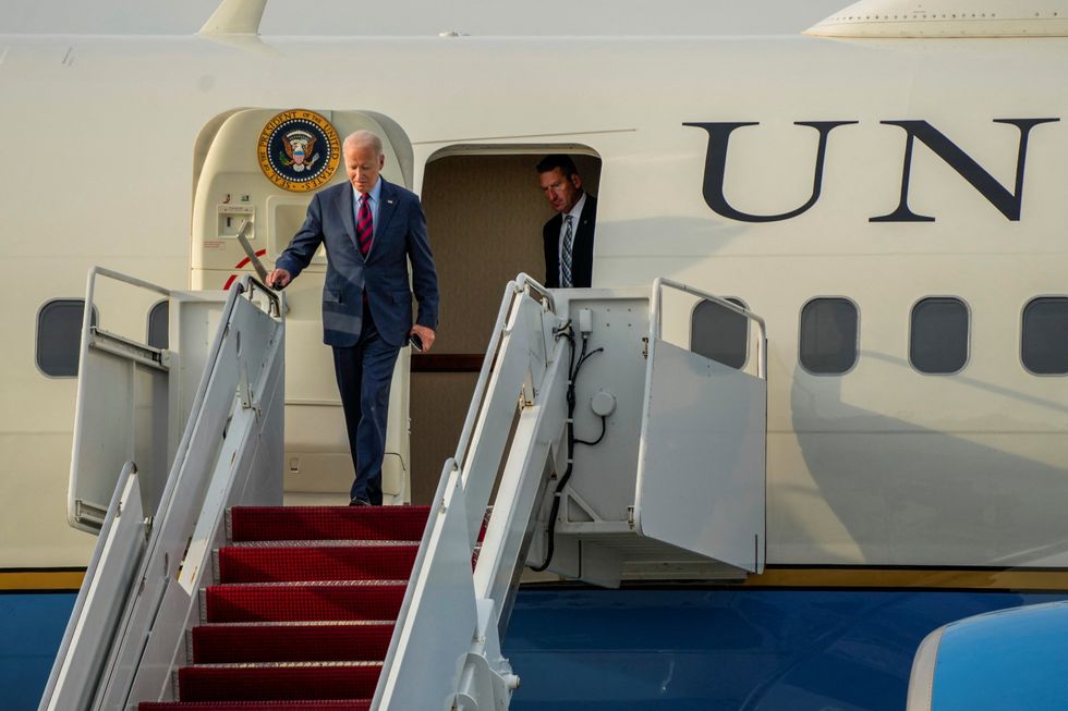U.S. President Joe Biden disembarks from Air Force One at Dover Air Force Base in Dover, Delaware
