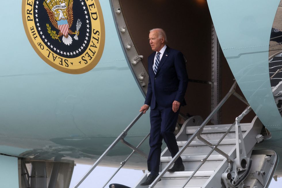 U.S. President Joe Biden disembarks from Air Force One to board Marine One and return to the White House