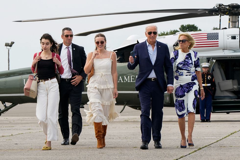 U.S. President Joe Biden, first lady Jill Biden, and granddaughters Finnegan and Natalie Biden walk from Marine One to Air Force One at Francis S. Gabreski Airport in Westhampton Beach