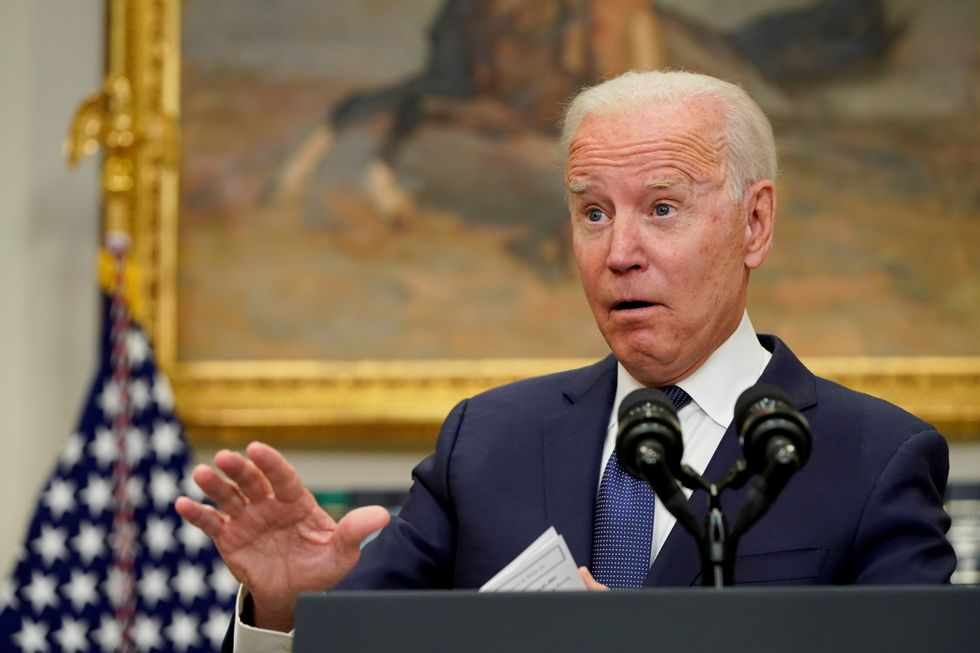 U.S. President Joe Biden gestures as he answers questions about Hurricane Henri and the evacuation of Afghanistan.