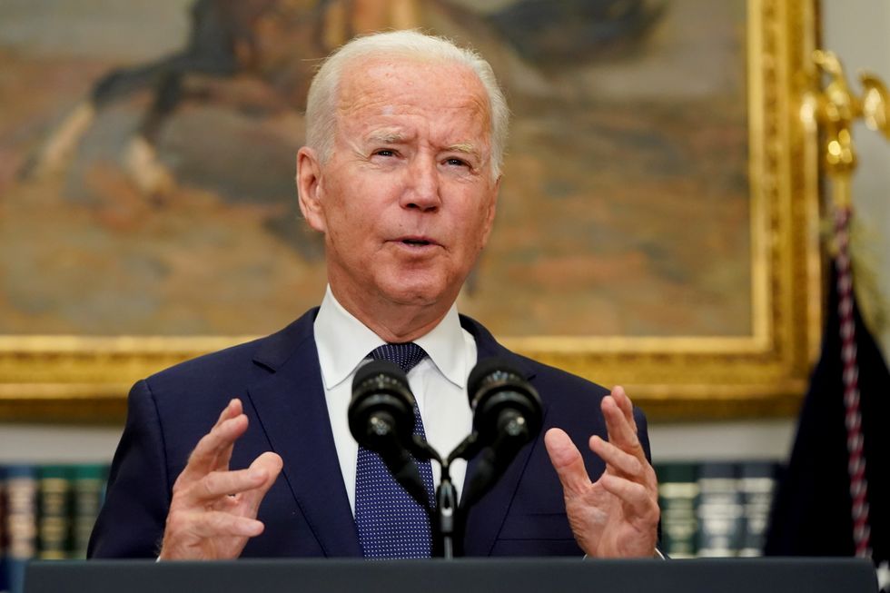 U.S. President Joe Biden gestures as he speaks about Hurricane Henri and the evacuation of Afghanistan, in the Roosevelt Room of the White House.
