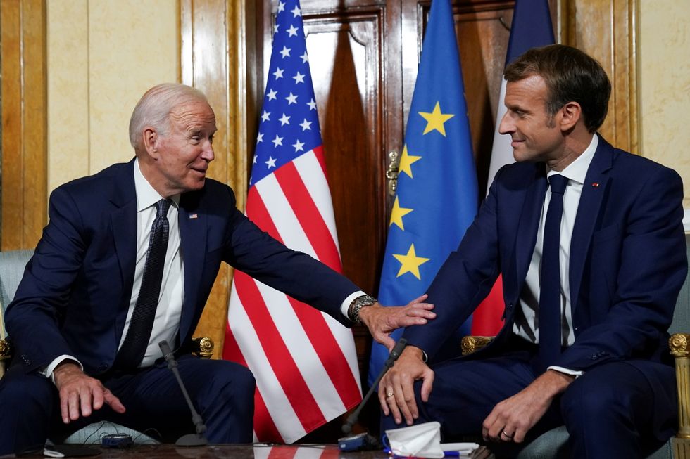 U.S. President Joe Biden meets with French President Emmanuel Macron ahead of the G20 summit in Rome, Italy October 29, 2021. REUTERS/Kevin Lamarque
