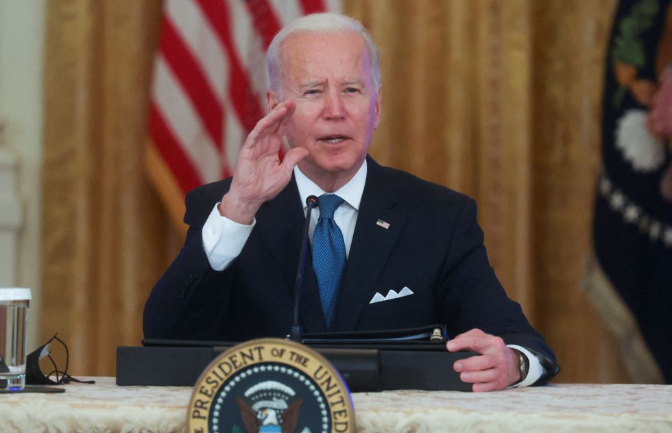 U.S. President Joe Biden responds to questions from reporters as he meets with his Competition Council in the East Room of the White House in Washington, U.S. January 24, 2022. REUTERS/Leah Millis