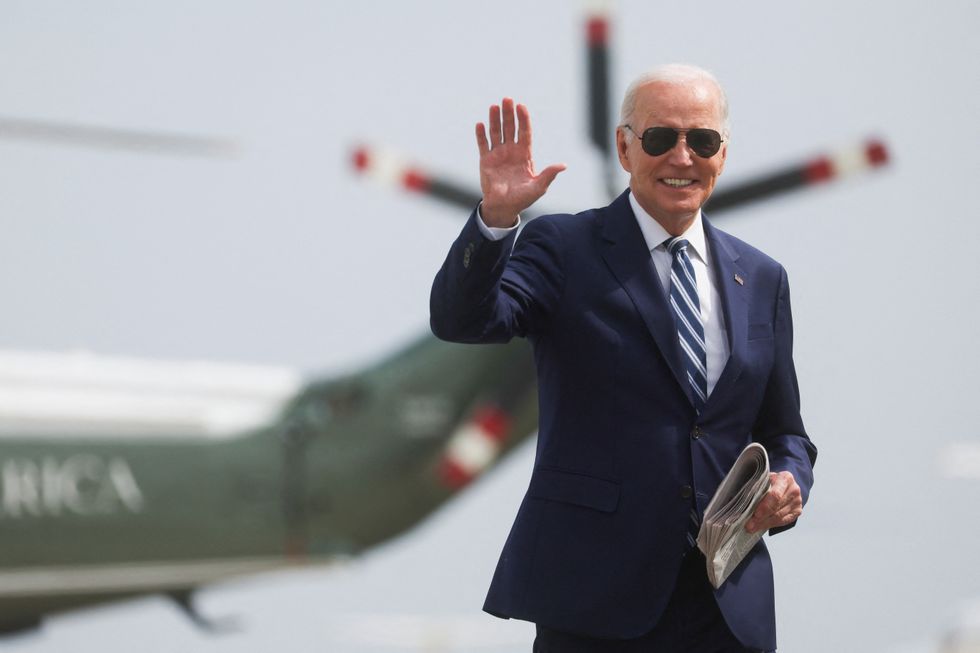 U.S. President Joe Biden walks to board Air Force One for travel to Chicago from Joint Base Andrews, Maryland