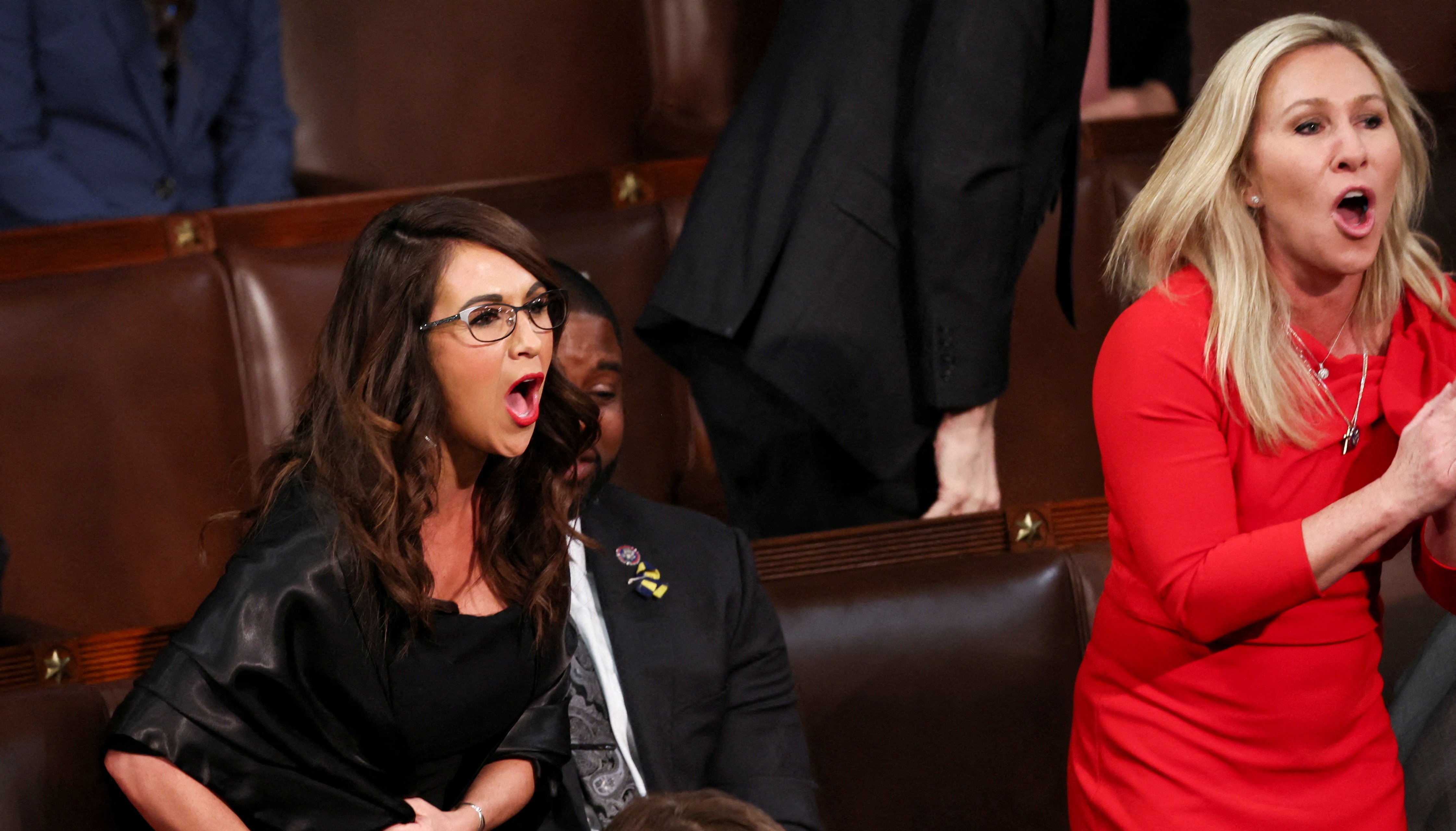 U.S. Rep. Lauren Boebert (R-CO) and Rep. Marjorie Taylor Greene (R-GA) scream %22Build the Wall%22 at President Joe Biden during Biden's State of the Union address to a joint session of the U.S. Congress in the House of Representatives Chamber at the Capitol in Washington, U.S. March 1, 2022. REUTERS/Evelyn Hockstein/Pool TPX IMAGES OF THE DAY