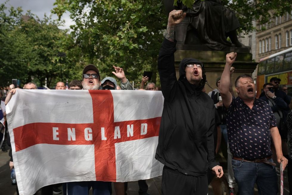 \u200b Far-right activists take part in a protest at Manchester City Centre