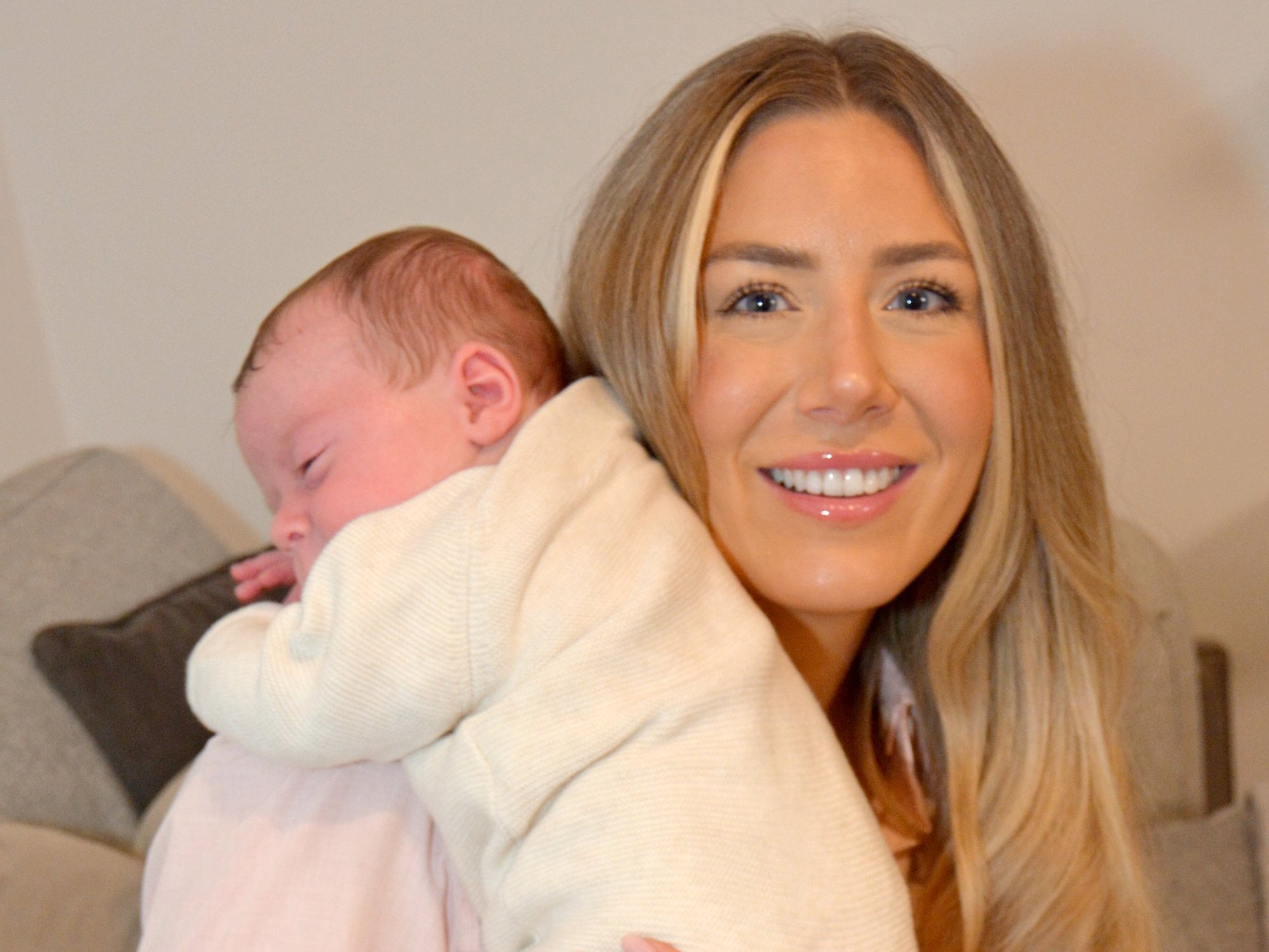 \u200b Grace Bell with her baby son Hugo Powell