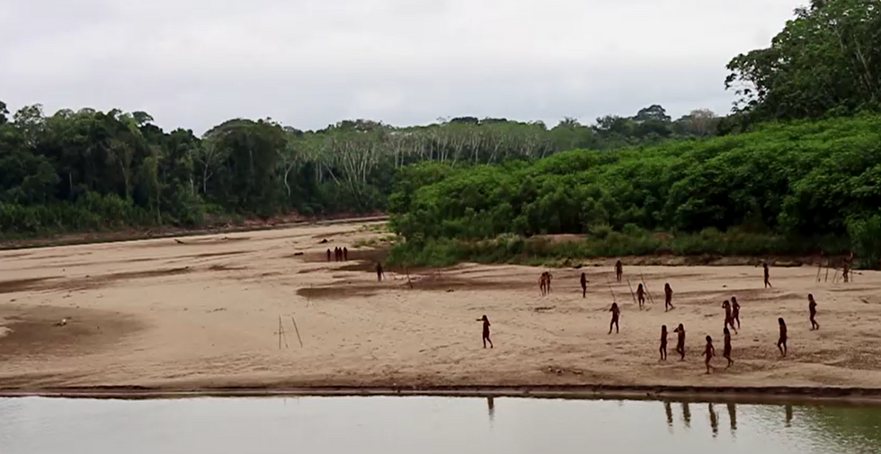 \u200b Indigenous people of the Mascho Piro tribe at riverbank