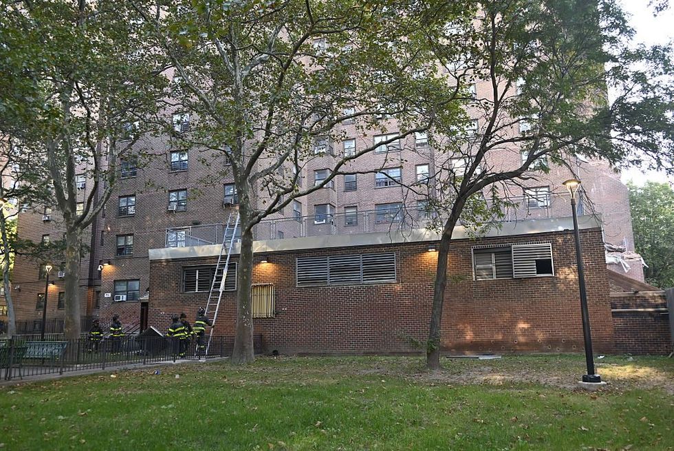 \u200b Members of the FDNY and authorities work the scene where a confirmed building collapse transpired at 205 Alexander Avenue in Bronx