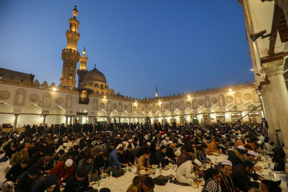 \u200b: Muslims gather for a communal iftar at Al-Azhar Mosque
