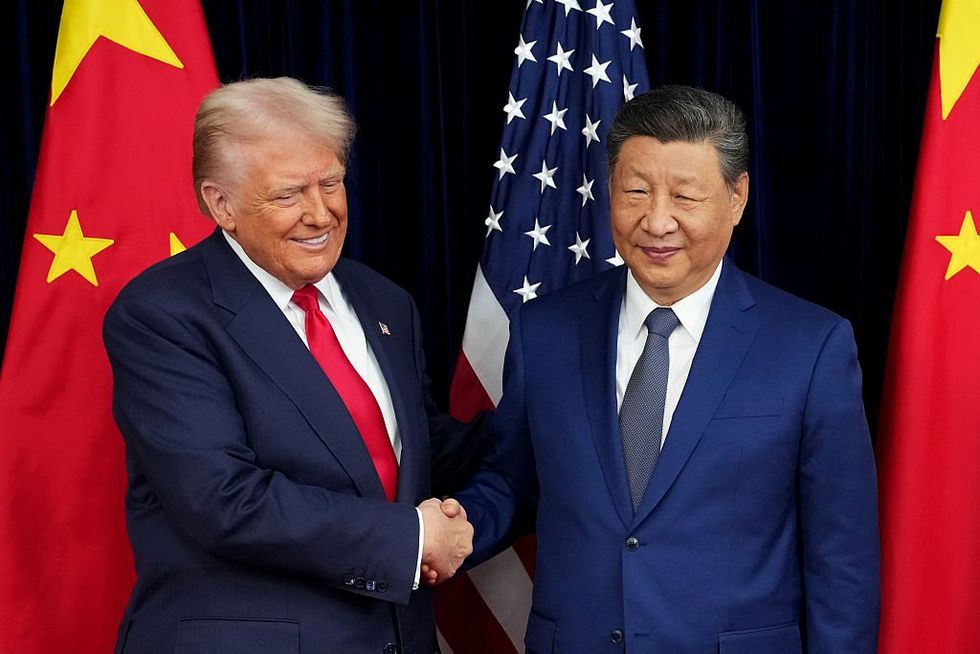 \u200b President Donald Trump greets Chinese President Xi Jinping